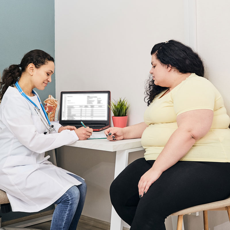 woman going over weight loss plan with patient